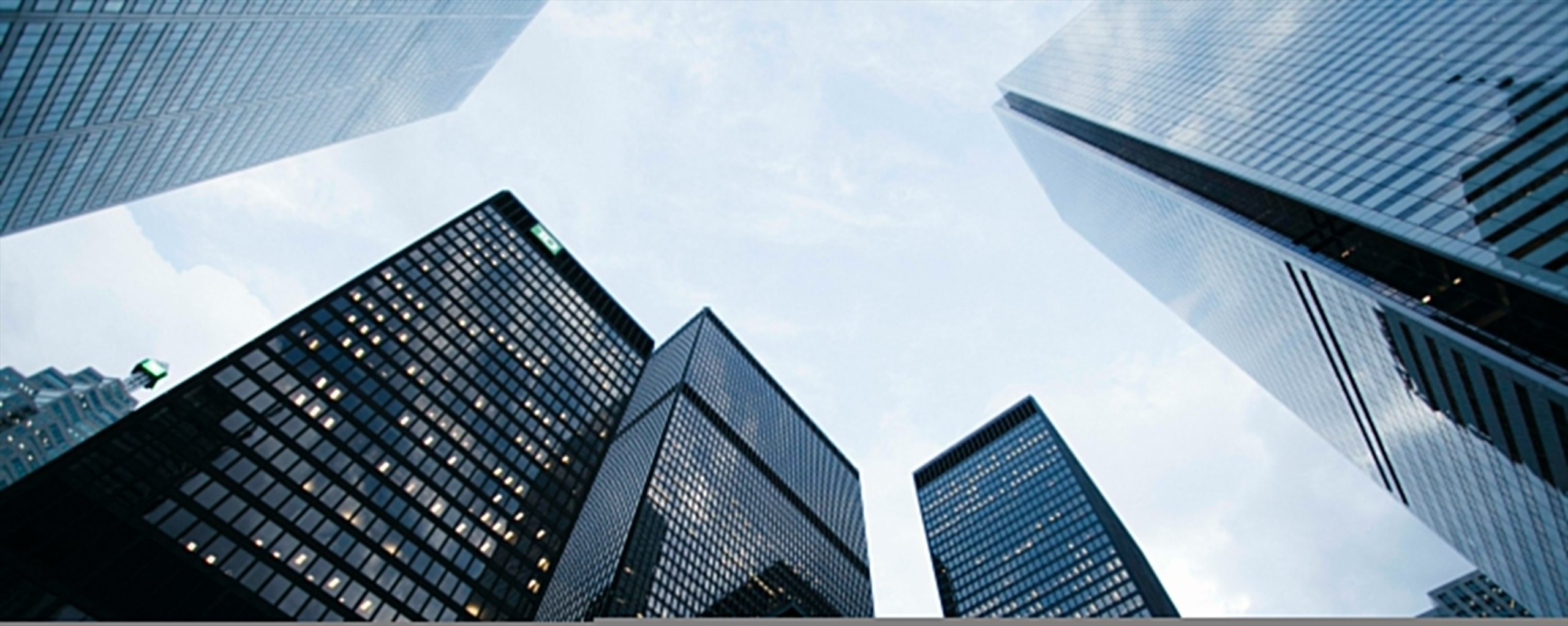 Glass office towers seen from street level